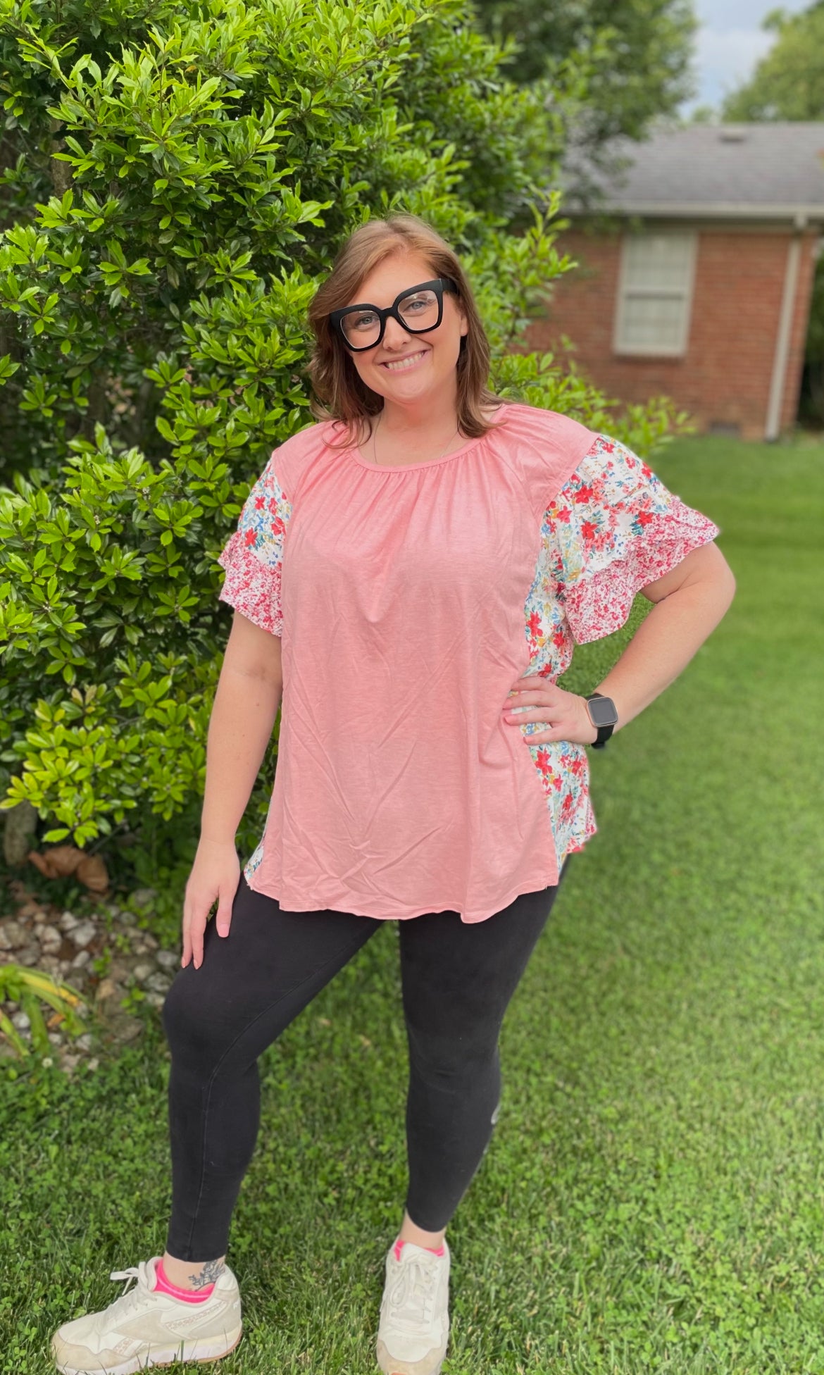 Pink blouse with floral accents